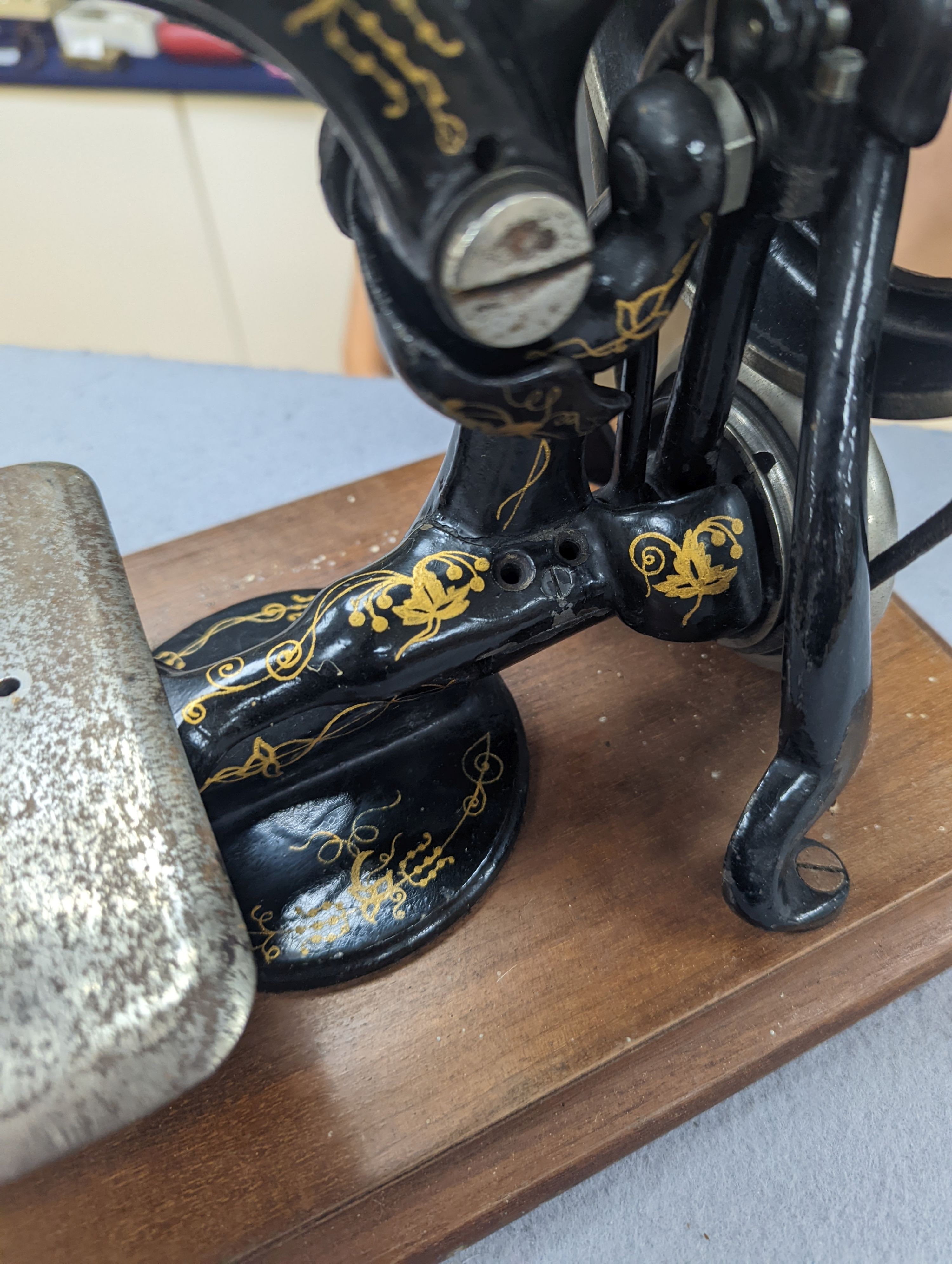 A Victorian sewing machine, Corona typewriter and two microscopes